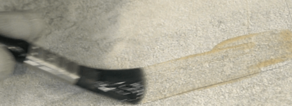 Primer being used to seal concrete surface for tape application